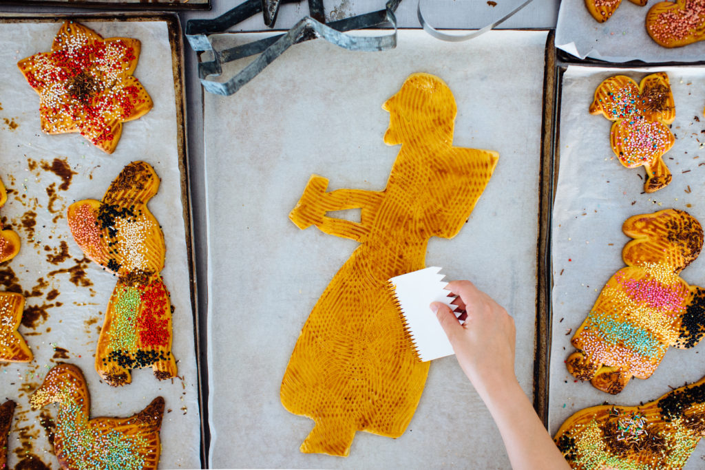 Preparing a biscuit on a baking tray